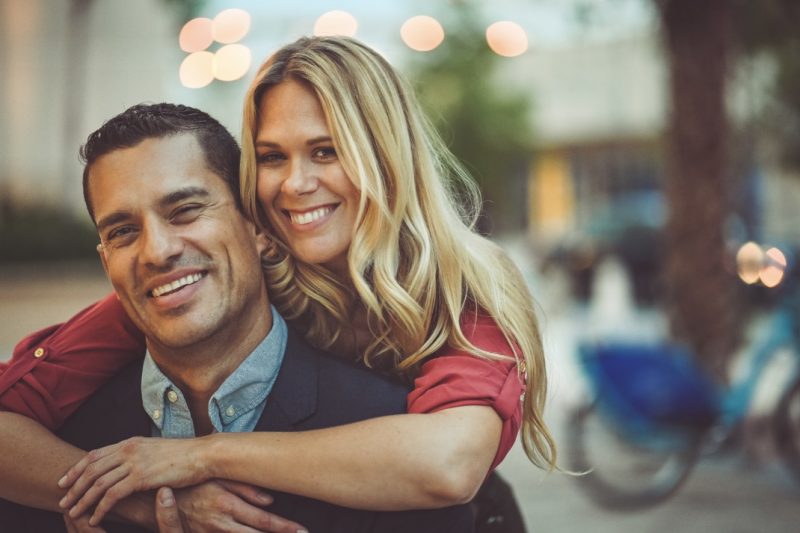 Middle-aged couple embracing at golden hour, symbolizing renewed vitality and closeness through Bioidentical Hormone Replacement Therapy.